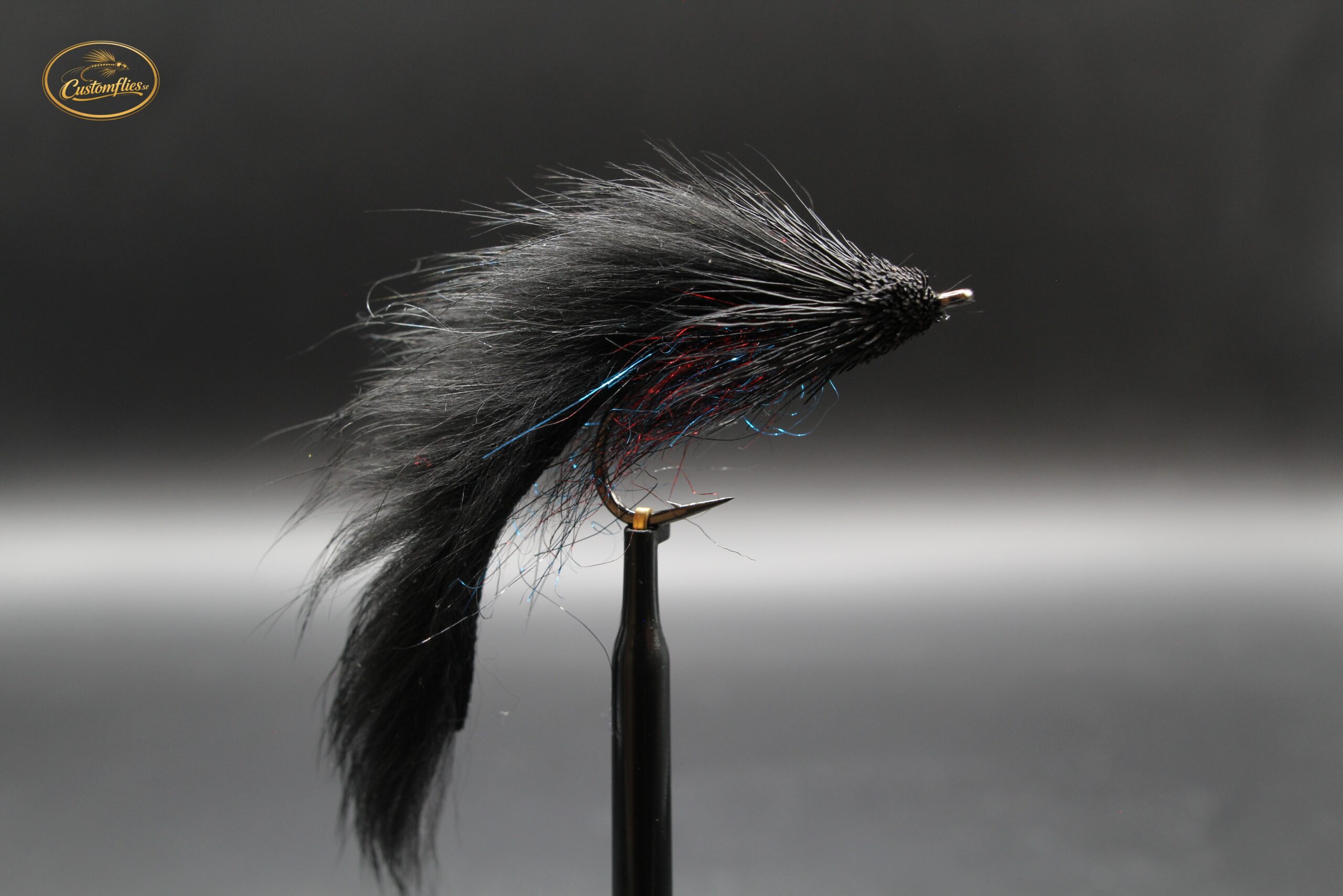 Black muddler ( Purple body )